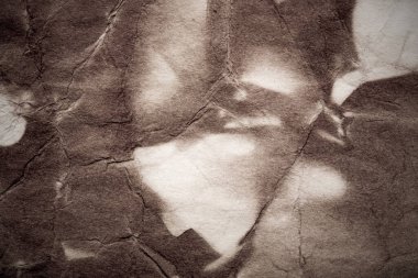 Eski kağıt çarşaf. Toz ve kirli lekelerle dolu boş bir arka plan. Eski ve antika sanat konsepti. Ayrıntılı yakın çekim stüdyo çekimi. Ön manzara. Ayarlanmış