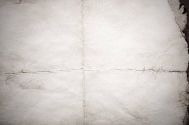 Eski kağıt çarşaf. Toz ve kirli lekelerle dolu boş bir arka plan. Eski ve antika sanat konsepti. Ayrıntılı yakın çekim stüdyo çekimi. Ön manzara. Ayarlanmış