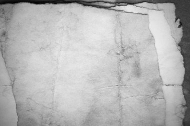 Eski kağıt çarşaf. Toz ve kirli lekelerle dolu boş bir arka plan. Eski ve antika sanat konsepti. Ayrıntılı yakın çekim stüdyo çekimi. Ön manzara. Ayarlanmış