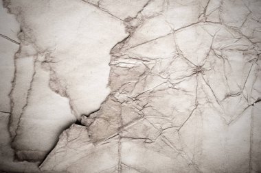 Eski kağıt çarşaf. Toz ve kirli lekelerle dolu boş bir arka plan. Eski ve antika sanat konsepti. Ayrıntılı yakın çekim stüdyo çekimi. Ön manzara. Ayarlanmış