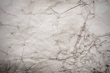 Eski kağıt çarşaf. Toz ve kirli lekelerle dolu boş bir arka plan. Eski ve antika sanat konsepti. Ayrıntılı yakın çekim stüdyo çekimi. Ön manzara. Ayarlanmış