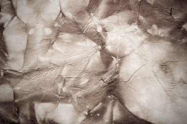 Eski kağıt çarşaf. Toz ve kirli lekelerle dolu boş bir arka plan. Eski ve antika sanat konsepti. Ayrıntılı yakın çekim stüdyo çekimi. Ön manzara. Ayarlanmış