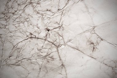 Eski kağıt çarşaf. Toz ve kirli lekelerle dolu boş bir arka plan. Eski ve antika sanat konsepti. Ayrıntılı yakın çekim stüdyo çekimi. Ön manzara. Ayarlanmış