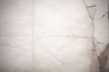 Eski kağıt çarşaf. Toz ve kirli lekelerle dolu boş bir arka plan. Eski ve antika sanat konsepti. Ayrıntılı yakın çekim stüdyo çekimi. Ön manzara. Ayarlanmış