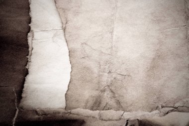 Eski kağıt çarşaf. Toz ve kirli lekelerle dolu boş bir arka plan. Eski ve antika sanat konsepti. Ayrıntılı yakın çekim stüdyo çekimi. Ön manzara. Ayarlanmış