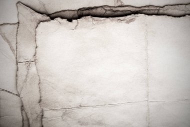 Eski kağıt çarşaf. Toz ve kirli lekelerle dolu boş bir arka plan. Eski ve antika sanat konsepti. Ayrıntılı yakın çekim stüdyo çekimi. Ön manzara. Ayarlanmış