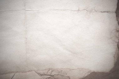 Eski kağıt çarşaf. Toz ve kirli lekelerle dolu boş bir arka plan. Eski ve antika sanat konsepti. Ayrıntılı yakın çekim stüdyo çekimi. Ön manzara. Ayarlanmış