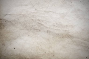 Eski kağıt çarşaf. Toz ve kirli lekelerle dolu boş bir arka plan. Eski ve antika sanat konsepti. Ayrıntılı yakın çekim stüdyo çekimi. Ön manzara. Ayarlanmış