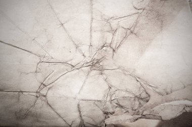 Eski kağıt çarşaf. Toz ve kirli lekelerle dolu boş bir arka plan. Eski ve antika sanat konsepti. Ayrıntılı yakın çekim stüdyo çekimi. Ön manzara. Ayarlanmış