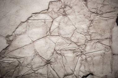 Eski kağıt çarşaf. Toz ve kirli lekelerle dolu boş bir arka plan. Eski ve antika sanat konsepti. Ayrıntılı yakın çekim stüdyo çekimi. Ön manzara. Ayarlanmış