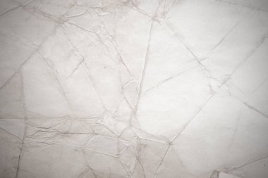 Eski kağıt çarşaf. Toz ve kirli lekelerle dolu boş bir arka plan. Eski ve antika sanat konsepti. Ayrıntılı yakın çekim stüdyo çekimi. Ön manzara. Ayarlanmış