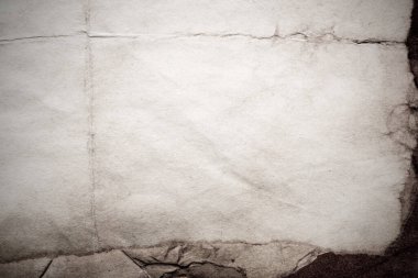 Eski kağıt çarşaf. Toz ve kirli lekelerle dolu boş bir arka plan. Eski ve antika sanat konsepti. Ayrıntılı yakın çekim stüdyo çekimi. Ön manzara. Ayarlanmış