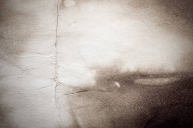 Eski kağıt çarşaf. Toz ve kirli lekelerle dolu boş bir arka plan. Eski ve antika sanat konsepti. Ayrıntılı yakın çekim stüdyo çekimi. Ön manzara. Ayarlanmış