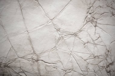 Eski kağıt çarşaf. Toz ve kirli lekelerle dolu boş bir arka plan. Eski ve antika sanat konsepti. Ayrıntılı yakın çekim stüdyo çekimi. Ön manzara. Ayarlanmış