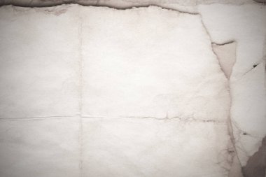 Eski kağıt çarşaf. Toz ve kirli lekelerle dolu boş bir arka plan. Eski ve antika sanat konsepti. Ayrıntılı yakın çekim stüdyo çekimi. Ön manzara. Ayarlanmış