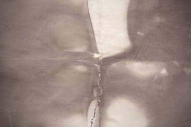 Eski kağıt çarşaf. Toz ve kirli lekelerle dolu boş bir arka plan. Eski ve antika sanat konsepti. Ayrıntılı yakın çekim stüdyo çekimi. Ön manzara. Ayarlanmış