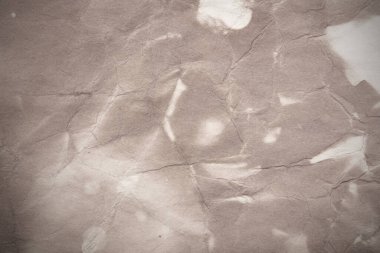 Eski kağıt çarşaf. Toz ve kirli lekelerle dolu boş bir arka plan. Eski ve antika sanat konsepti. Ayrıntılı yakın çekim stüdyo çekimi. Ön manzara. Ayarlanmış