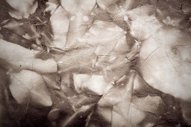 Eski kağıt çarşaf. Toz ve kirli lekelerle dolu boş bir arka plan. Eski ve antika sanat konsepti. Ayrıntılı yakın çekim stüdyo çekimi. Ön manzara. Ayarlanmış