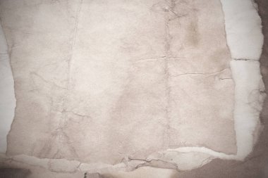 Eski kağıt çarşaf. Toz ve kirli lekelerle dolu boş bir arka plan. Eski ve antika sanat konsepti. Ayrıntılı yakın çekim stüdyo çekimi. Ön manzara. Ayarlanmış