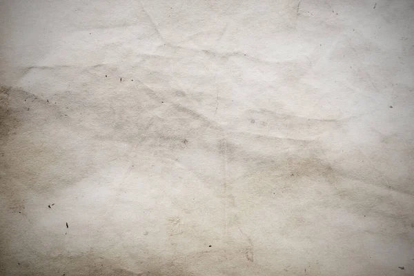 Eski kağıt çarşaf. Toz ve kirli lekelerle dolu boş bir arka plan. Eski ve antika sanat konsepti. Ayrıntılı yakın çekim stüdyo çekimi. Ön manzara. Ayarlanmış