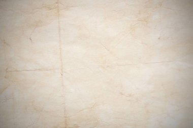 Eski kağıt çarşaf. Toz ve kirli lekelerle dolu boş bir arka plan. Eski ve antika sanat konsepti. Ayrıntılı yakın çekim stüdyo çekimi. Ön manzara. Ayarlanmış