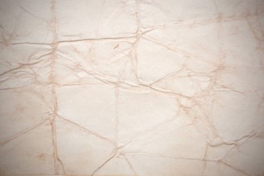 Eski kağıt çarşaf. Toz ve kirli lekelerle dolu boş bir arka plan. Eski ve antika sanat konsepti. Ayrıntılı yakın çekim stüdyo çekimi. Ön manzara. Ayarlanmış