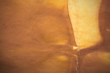 Eski kağıt çarşaf. Toz ve kirli lekelerle dolu boş bir arka plan. Eski ve antika sanat konsepti. Ayrıntılı yakın çekim stüdyo çekimi. Ön manzara. Ayarlanmış