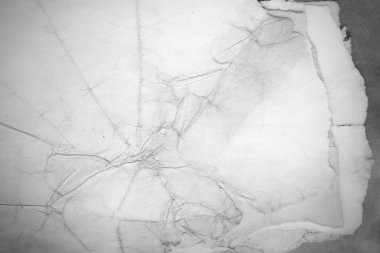 Eski kağıt çarşaf. Toz ve kirli lekelerle dolu boş bir arka plan. Eski ve antika sanat konsepti. Ayrıntılı yakın çekim stüdyo çekimi. Ön manzara. Ayarlanmış