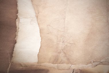 Eski kağıt çarşaf. Toz ve kirli lekelerle dolu boş bir arka plan. Eski ve antika sanat konsepti. Ayrıntılı yakın çekim stüdyo çekimi. Ön manzara. Ayarlanmış