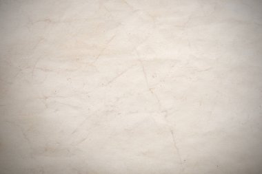 Eski kağıt çarşaf. Toz ve kirli lekelerle dolu boş bir arka plan. Eski ve antika sanat konsepti. Ayrıntılı yakın çekim stüdyo çekimi. Ön manzara. Ayarlanmış