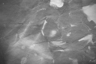 Eski kağıt çarşaf. Toz ve kirli lekelerle dolu boş bir arka plan. Eski ve antika sanat konsepti. Ayrıntılı yakın çekim stüdyo çekimi. Ön manzara. Ayarlanmış