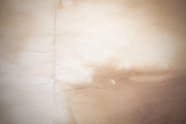 Стареющий лист бумаги. Пустой старый фон с пылью и грязными пятнами. Винтажное и антикварное искусство. Подробная съемка студии крупным планом. Вид спереди. Toned
