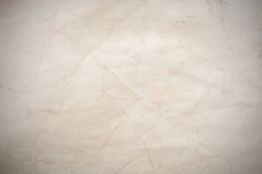 Eski kağıt çarşaf. Toz ve kirli lekelerle dolu boş bir arka plan. Eski ve antika sanat konsepti. Ayrıntılı yakın çekim stüdyo çekimi. Ön manzara. Ayarlanmış