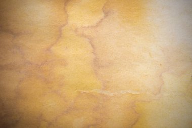 Aged paper sheet. Blank old background with dust and dirty stains. Vintage and antique art concept. Poster mockup. Detailed closeup studio shot. Front view. Toned