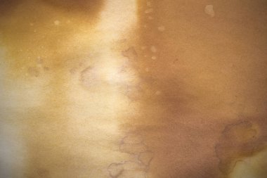 Aged paper sheet. Blank old background with dust and dirty stains. Vintage and antique art concept. Poster mockup. Detailed closeup studio shot. Front view. Toned