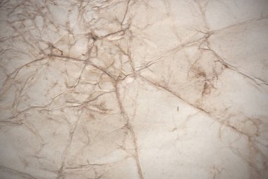 Aged paper sheet. Blank old background with dust and dirty stains. Vintage and antique art concept. Poster mockup. Detailed closeup studio shot. Front view. Toned