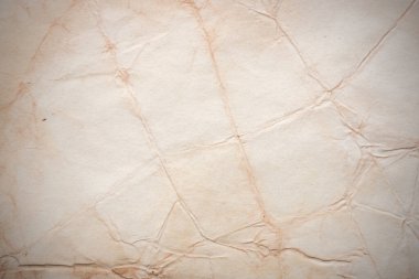 Aged paper sheet. Blank old background with dust and dirty stains. Vintage and antique art concept. Poster mockup. Detailed closeup studio shot. Front view. Toned