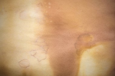 Aged paper sheet. Blank old background with dust and dirty stains. Vintage and antique art concept. Poster mockup. Detailed closeup studio shot. Front view. Toned