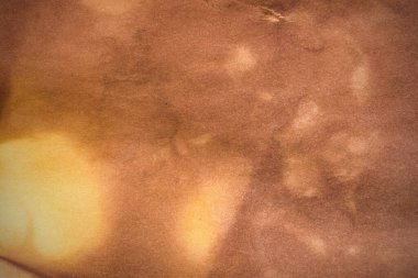 Aged paper sheet. Blank old background with dust and dirty stains. Vintage and antique art concept. Poster mockup. Detailed closeup studio shot. Front view. Toned