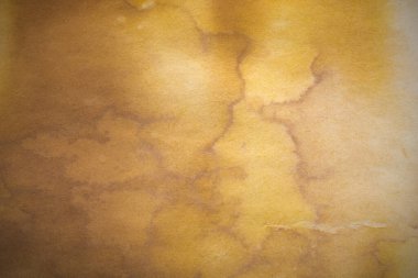 Aged paper sheet. Blank old background with dust and dirty stains. Vintage and antique art concept. Poster mockup. Detailed closeup studio shot. Front view. Toned