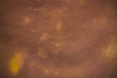 Aged paper sheet. Blank old background with dust and dirty stains. Vintage and antique art concept. Poster mockup. Detailed closeup studio shot. Front view. Toned