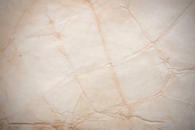 Aged paper sheet. Blank old background with dust and dirty stains. Vintage and antique art concept. Poster mockup. Detailed closeup studio shot. Front view. Toned