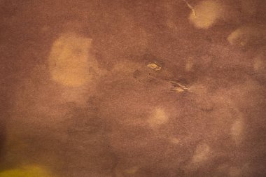 Aged paper sheet. Blank old background with dust and dirty stains. Vintage and antique art concept. Poster mockup. Detailed closeup studio shot. Front view. Toned