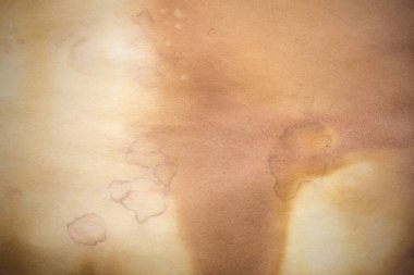 Aged paper sheet. Blank old background with dust and dirty stains. Vintage and antique art concept. Poster mockup. Detailed closeup studio shot. Front view. Toned