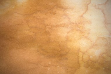 Aged paper sheet. Blank old background with dust and dirty stains. Vintage and antique art concept. Poster mockup. Detailed closeup studio shot. Front view. Toned