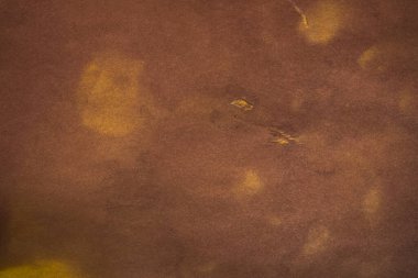 Aged paper sheet. Blank old background with dust and dirty stains. Vintage and antique art concept. Poster mockup. Detailed closeup studio shot. Front view. Toned