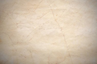 Aged paper sheet. Blank old background with dust and dirty stains. Vintage and antique art concept. Poster mockup. Detailed closeup studio shot. Front view. Toned