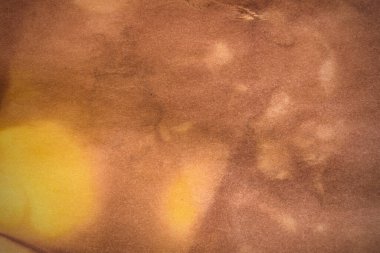 Aged paper sheet. Blank old background with dust and dirty stains. Vintage and antique art concept. Poster mockup. Detailed closeup studio shot. Front view. Toned