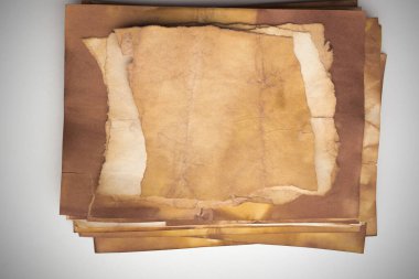 Aged paper sheet. Blank old background with dust and dirty stains. Vintage and antique art concept. Poster mockup. Detailed closeup studio shot. Front view. Toned