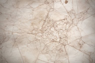 Aged paper sheet. Blank old background with dust and dirty stains. Vintage and antique art concept. Poster mockup. Detailed closeup studio shot. Front view. Toned